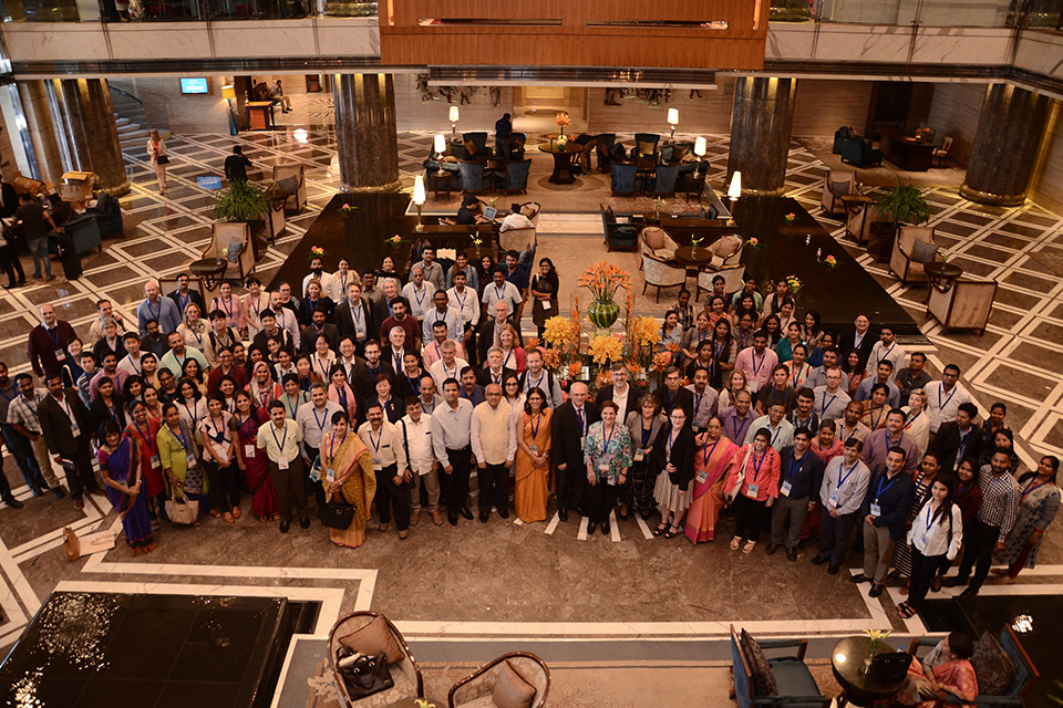 Photograph taken from top to bottom of a large group of about 200 people