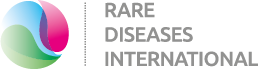 En logga med en ring i färgerna röd grön och blå med texten Rare Diseases International