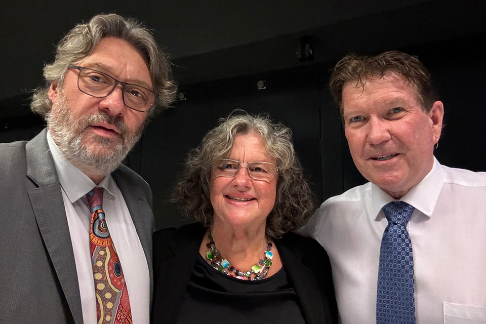 Mikk Cederroth, Helene Cederroth, and Dave Pearce smiling together in a close-up group picture at the award evening.