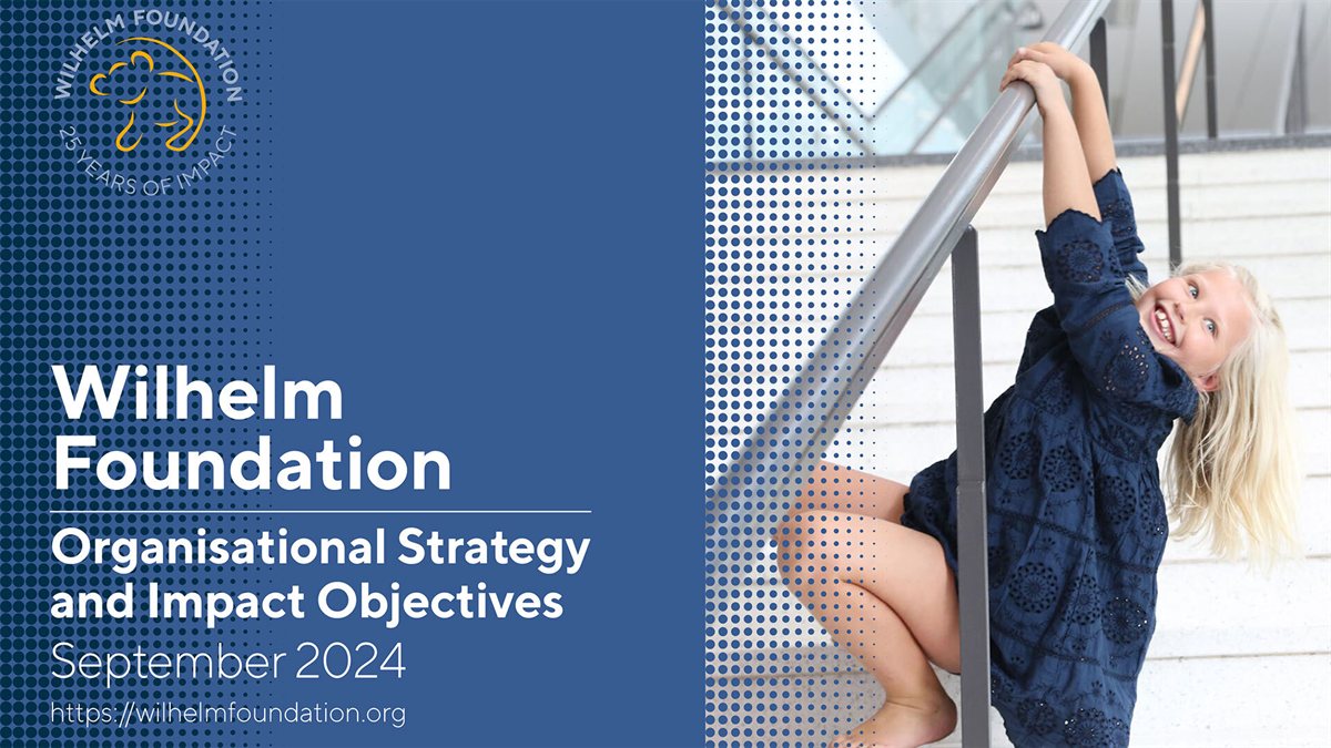 Cover of the Wilhelm Foundation strategy September 2024, with a smiling girl climbing a stair railing